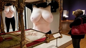 Porn exhibition with a naked woman with big breasts